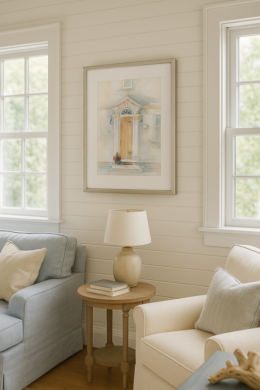 Living room with gray sofa, beige armchair, and side table with lamp.